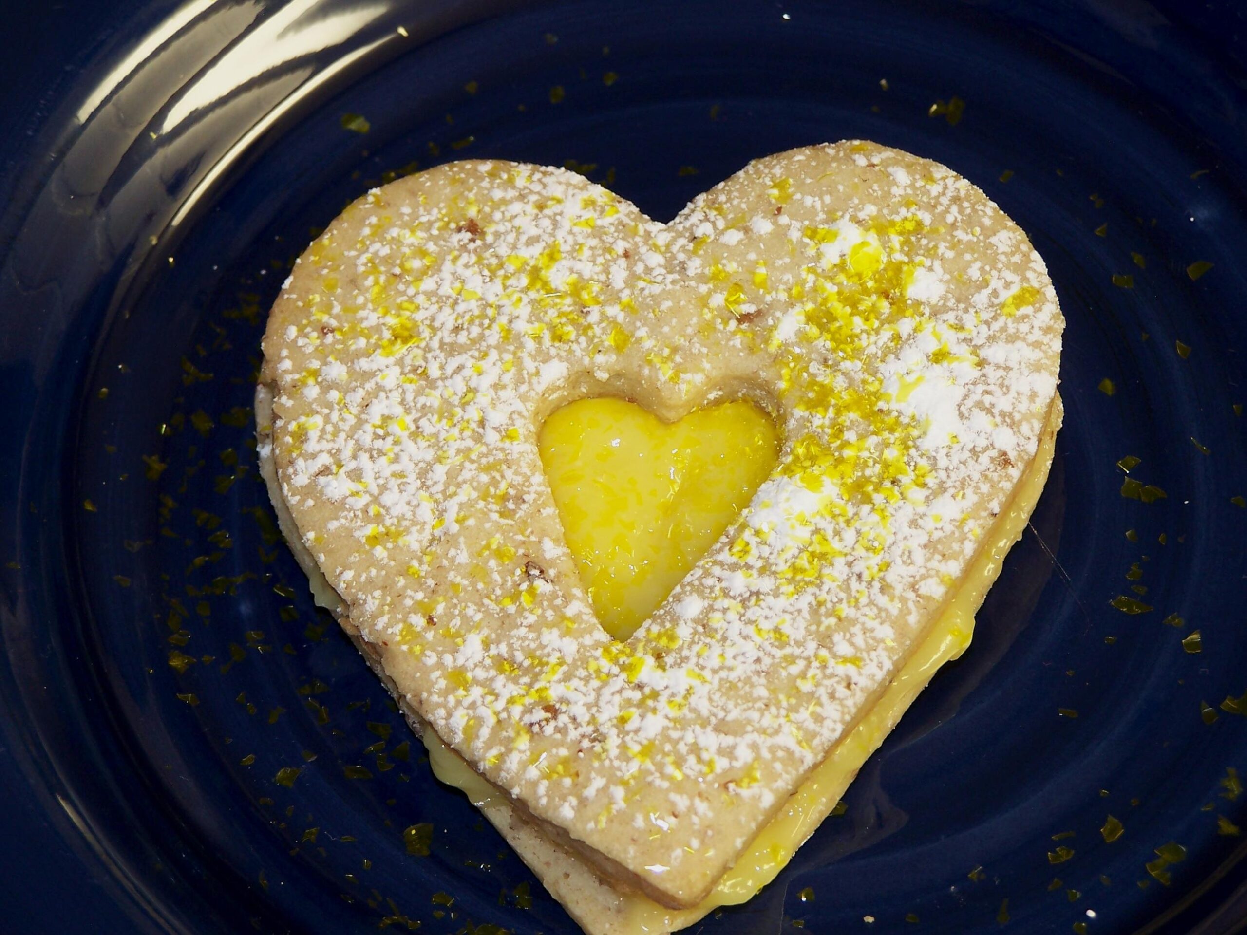  A batch of golden-yellow cookies filled with luscious lemon curd.