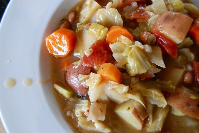  A hearty bowl of Crockpot Irish White Bean and Cabbage Soup, perfect for a cozy night in.
