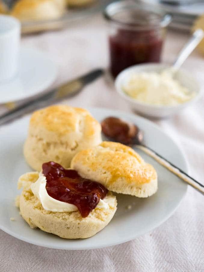  A stack of warm scones, waiting to be topped with your favorite spreads and enjoyed with a cup of tea.