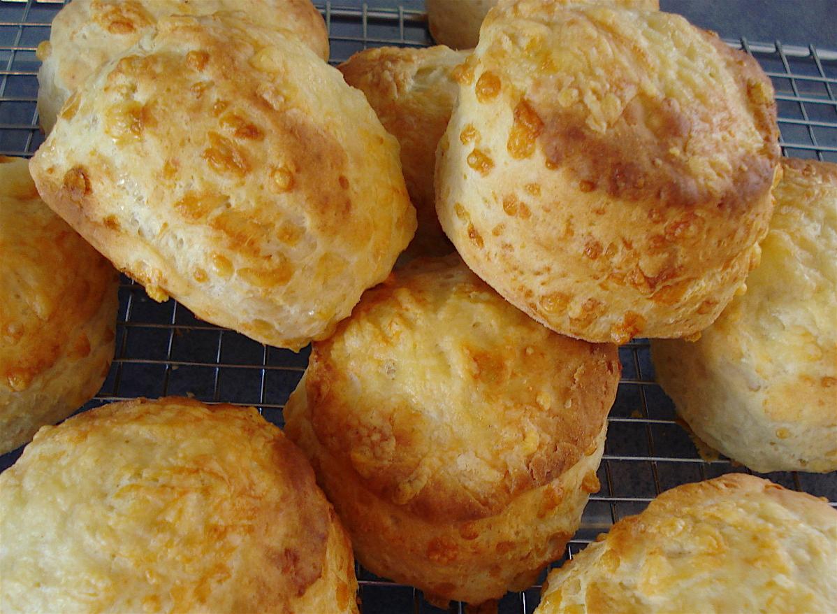  Freshly baked scones, hot out of the oven, with a crispy golden exterior.