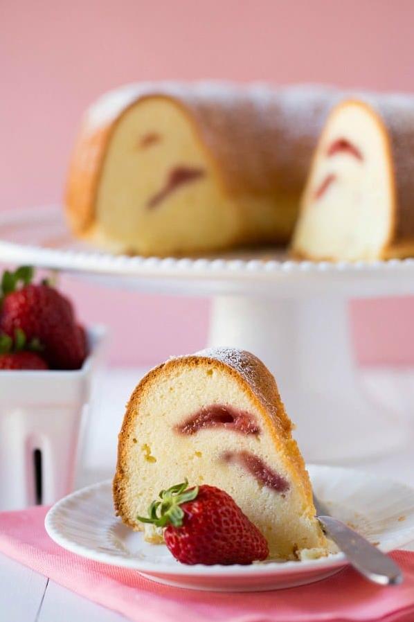  Get swept away with the taste of summer in every slice of this Cream Cheese Pound Cake with fresh strawberries and whipped cream.