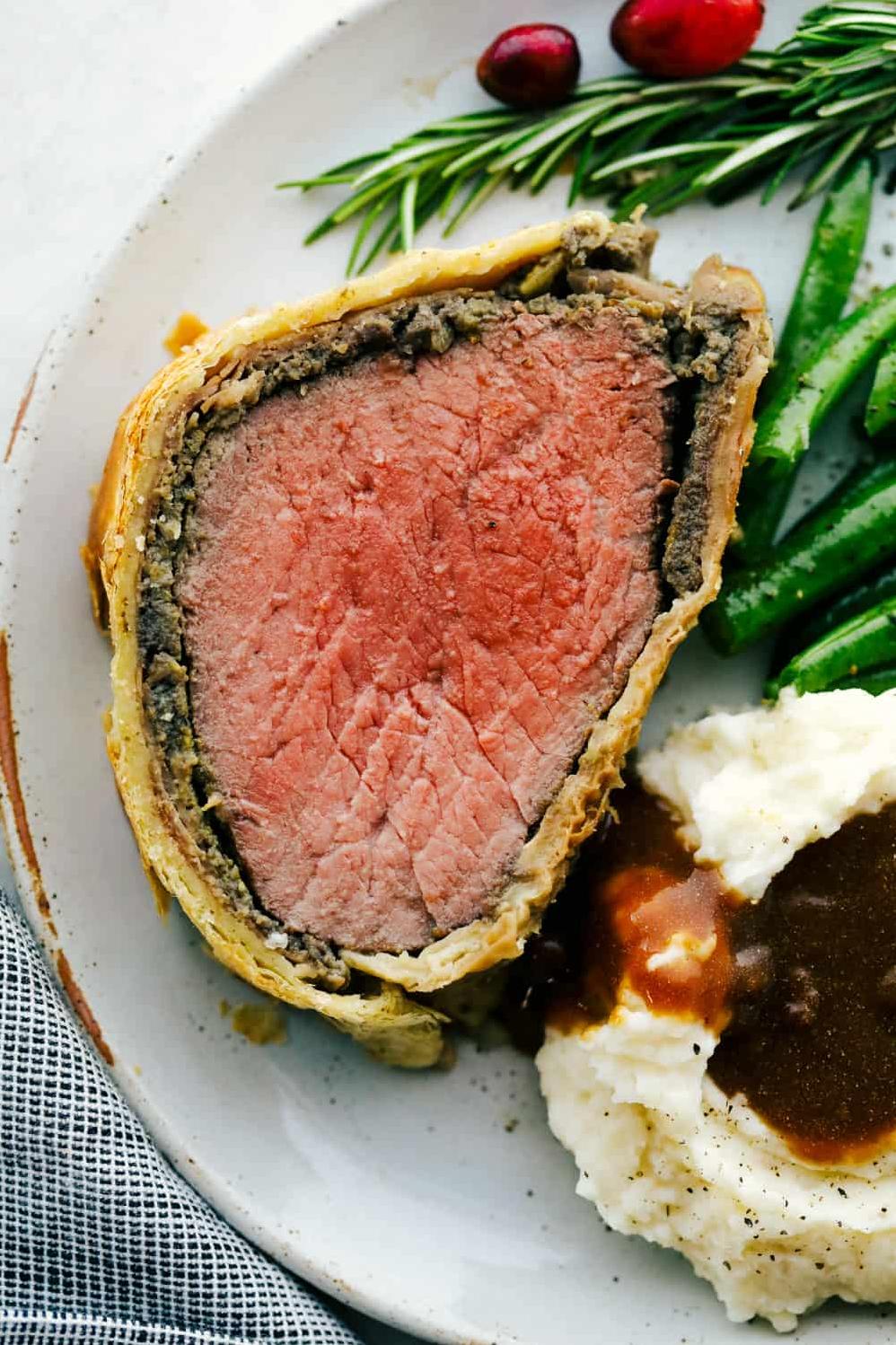  Juicy beef tenderloin wrapped in a crispy, golden brown pastry crust.