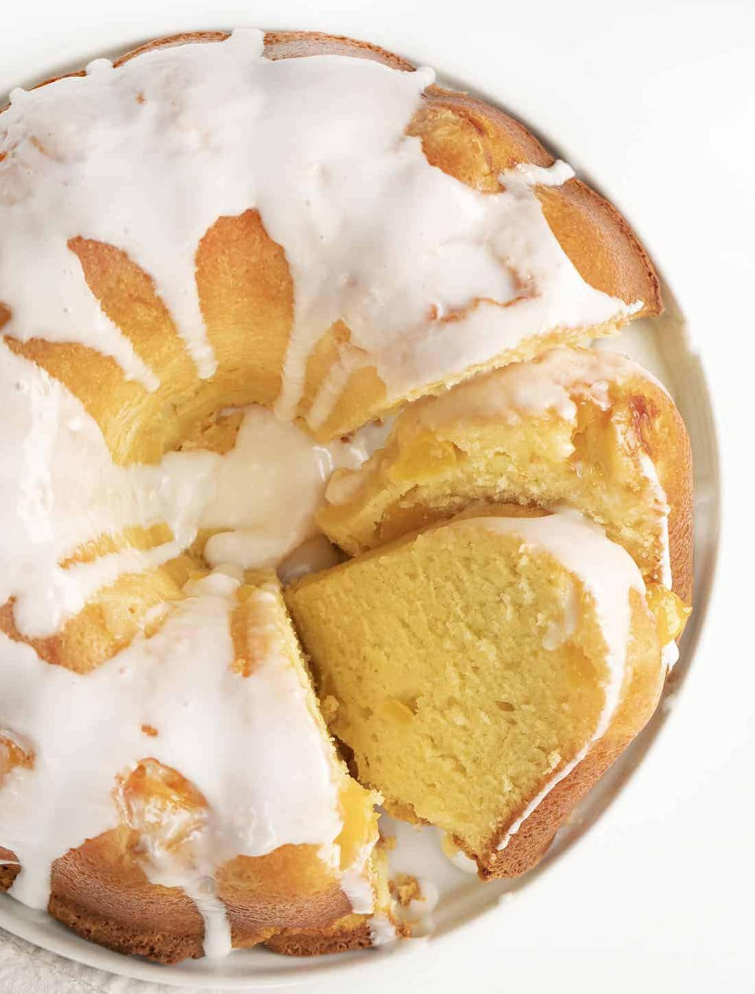  Slices of juicy peaches sit atop this perfectly golden pound cake