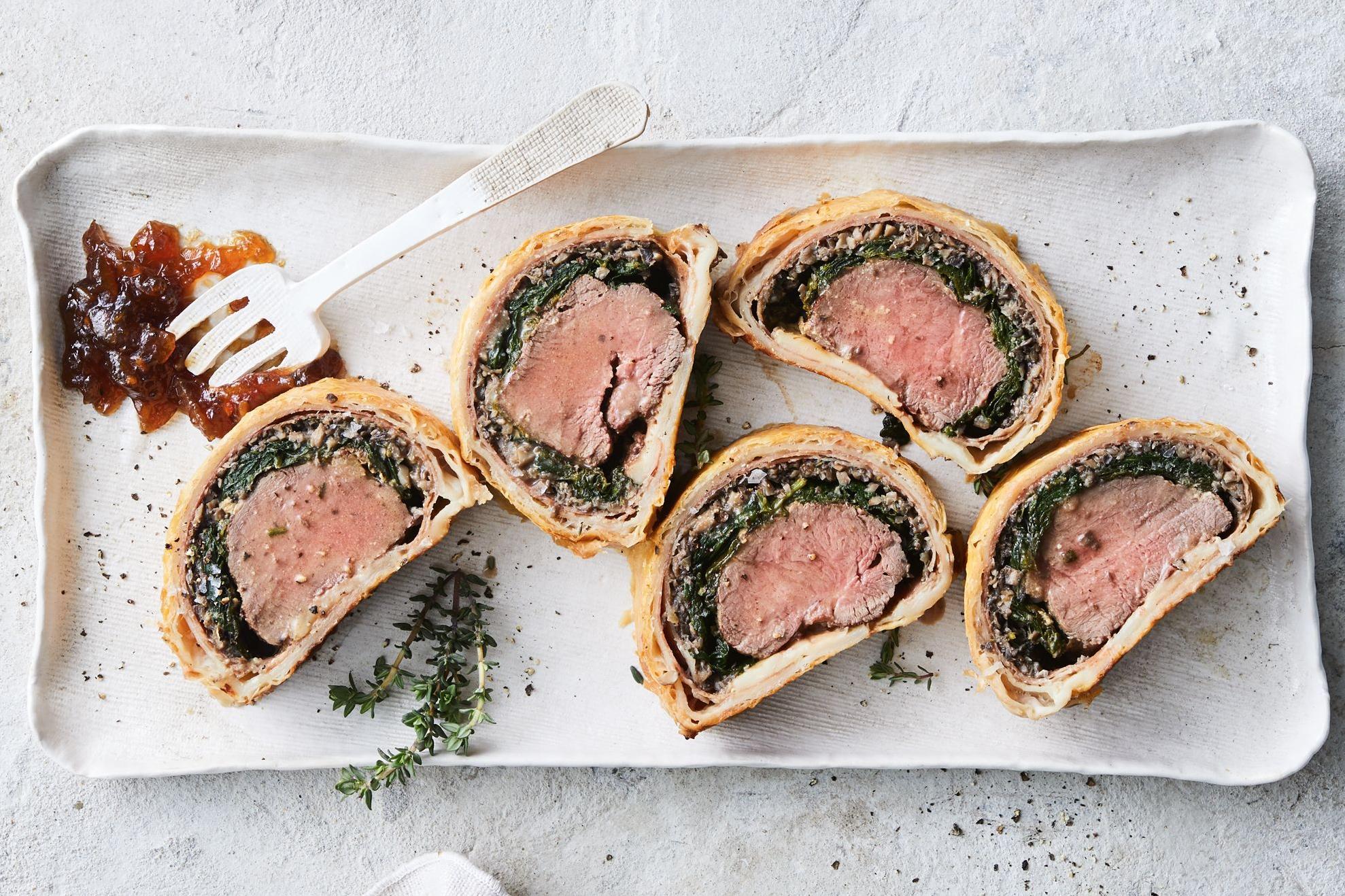  The savory aroma of perfectly cooked beef and mushrooms wrapped in a tender pastry shell.